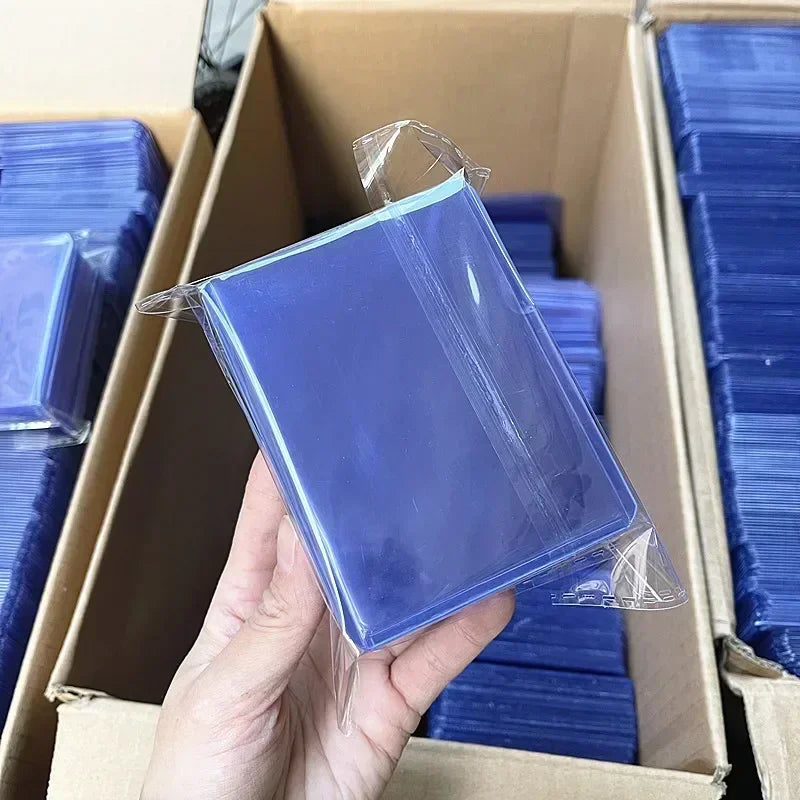 100 יחידות סליבים קשיחים לקלפי אספנות – פלסטיק שקוף